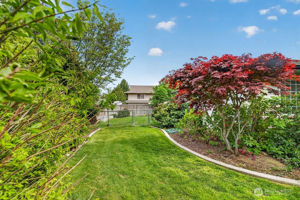 2105 Sutton Place Wenatchee, WA 98801 - Photo 7 of 39 a view of a house with a backyard