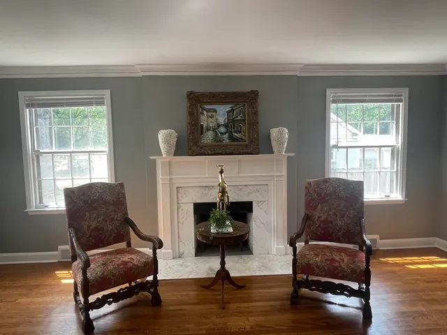 a living room with furniture and a fireplace