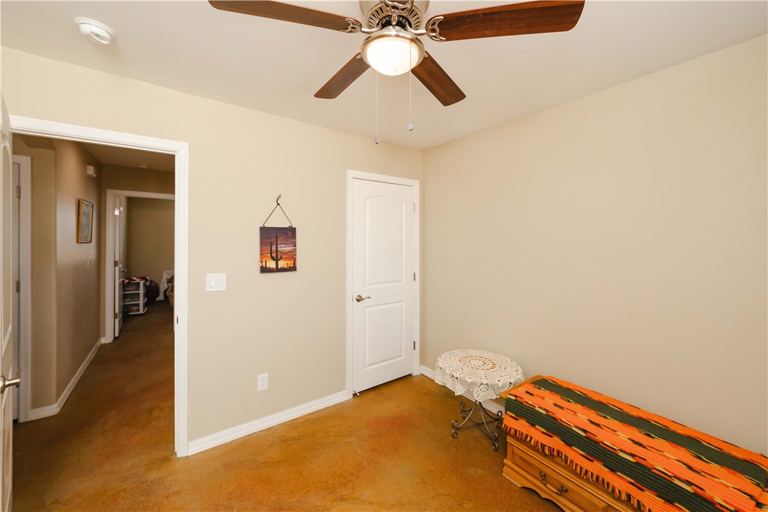 2948 Pinal Road Golden Valley, AZ 86413 - Photo 27 of 59 Neutral-toned walls complement the carpeted flooring