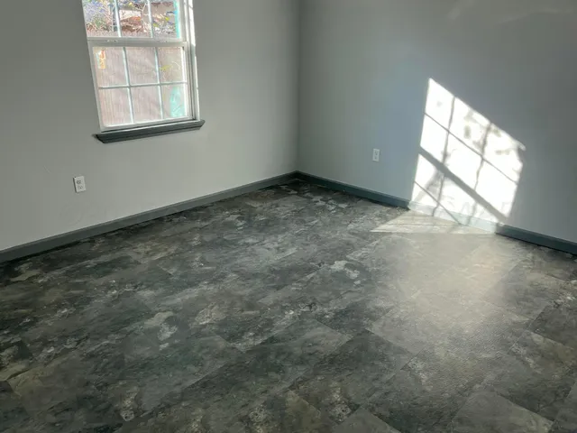 an empty room with windows