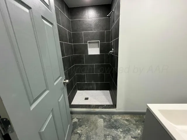 a bathroom with a sink and mirror