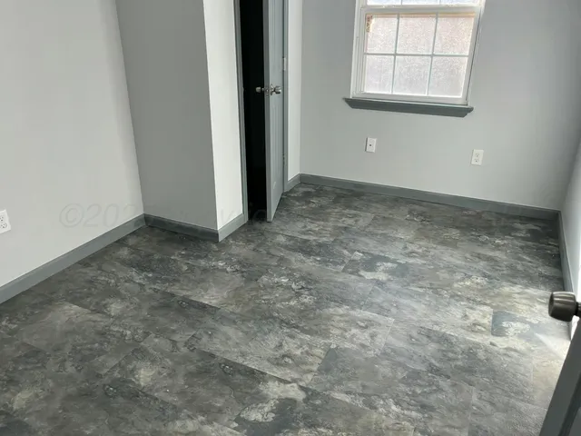 an empty room with windows