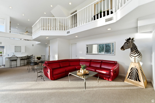 1878 East Ridge Point Drive Bountiful, UT 84010 - Photo 48 of 92 Carpeted living area with recessed lighting and a high ceiling