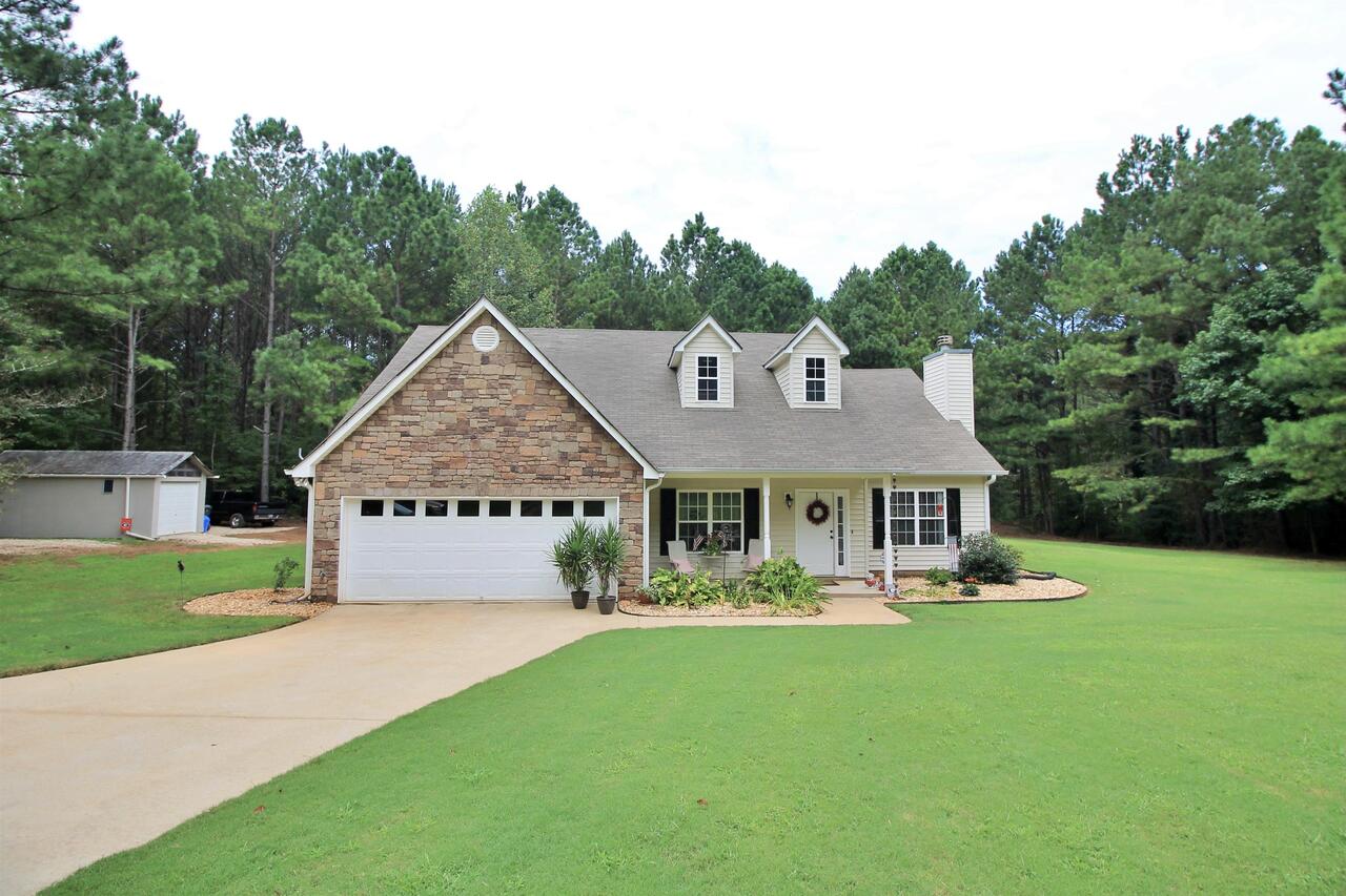 216 Dub Walker Road Jackson, GA 30233 - Photo 1 of 1 a front view of a house with garden