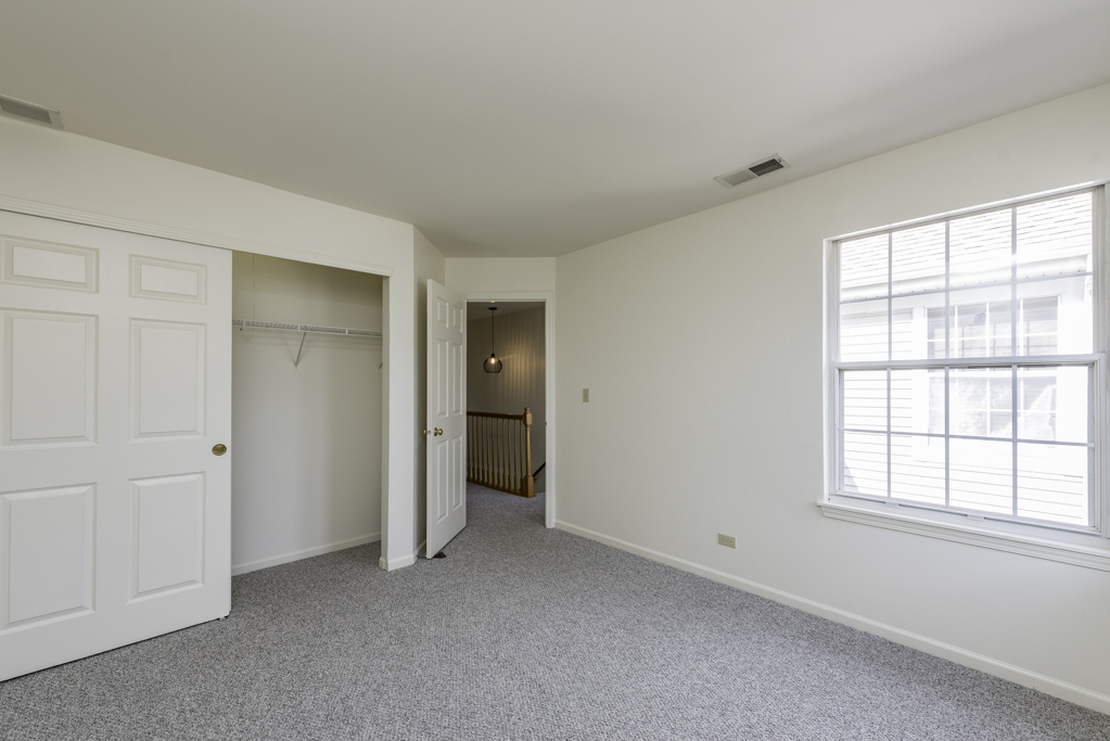 17775 Braewick Road Gurnee, IL 60031 - Photo 7 of 25 an empty room with windows and closet