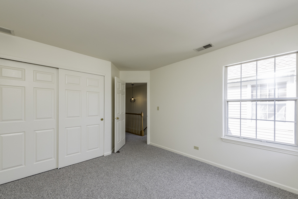 17775 Braewick Road Gurnee, IL 60031 - Photo 8 of 25 an empty room with windows and closet