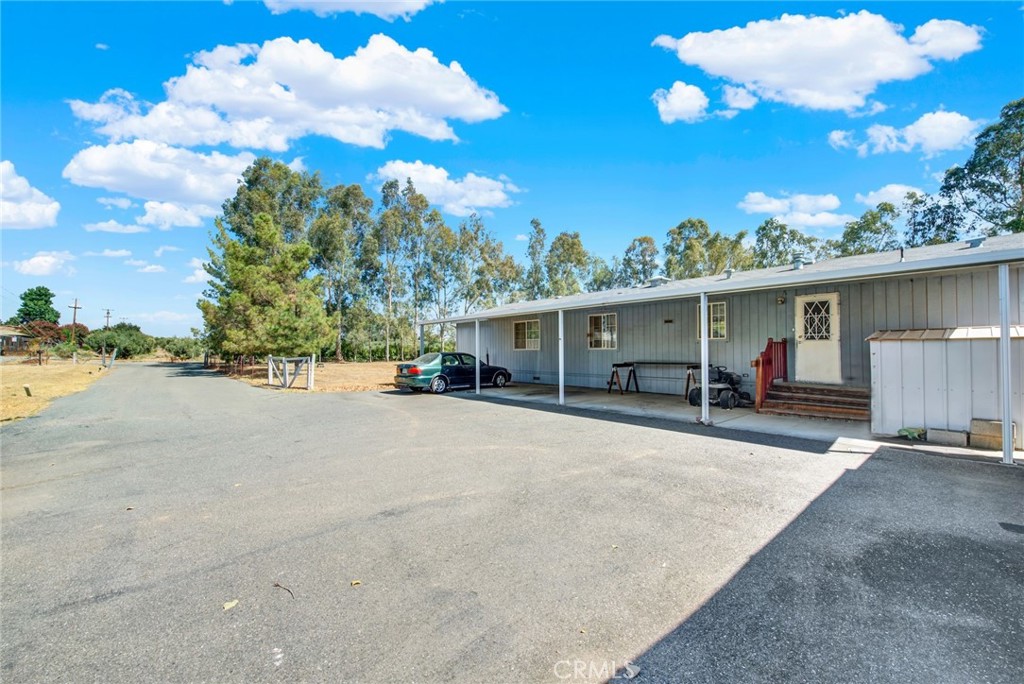 521 East Divisadero Corning, CA 96021 - Photo 11 of 54 a view of a house with backyard and sitting area