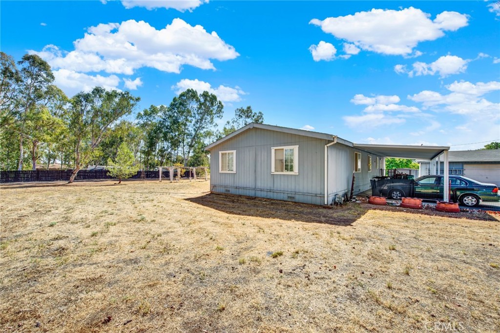 521 East Divisadero Corning, CA 96021 - Photo 16 of 54 a view of a house with backyard of snow and trees
