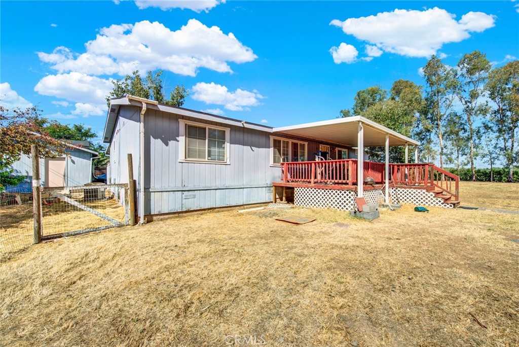521 East Divisadero Corning, CA 96021 - Photo 18 of 54 a view of a house with backyard and trees