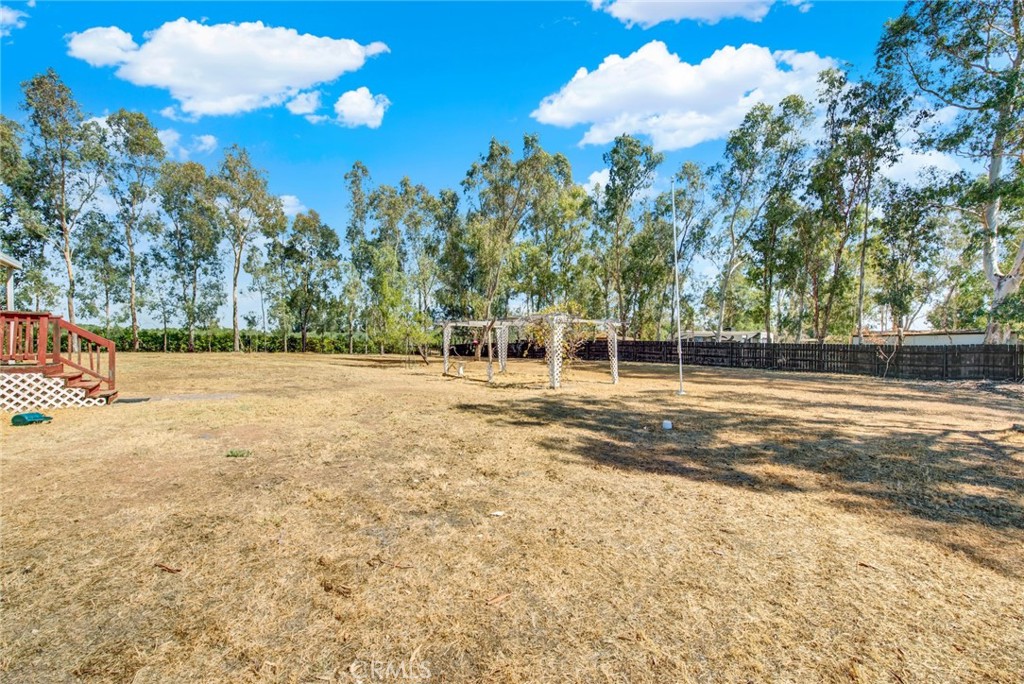 521 East Divisadero Corning, CA 96021 - Photo 19 of 54 a backyard of a house with lots of green space and outdoor space