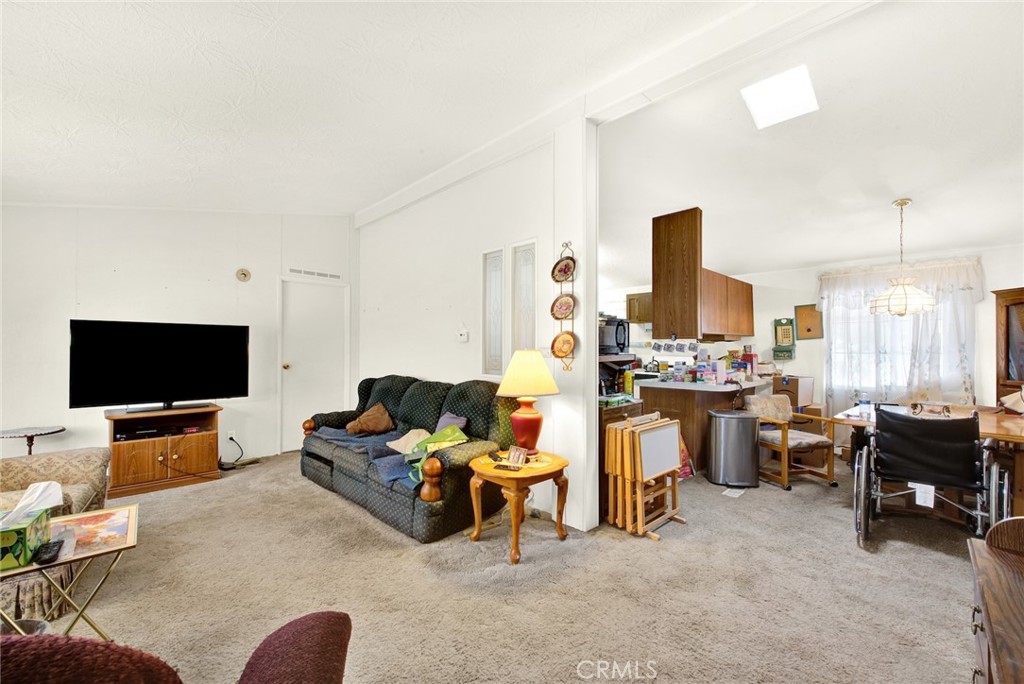 521 East Divisadero Corning, CA 96021 - Photo 29 of 54 a living room with furniture and a flat screen tv