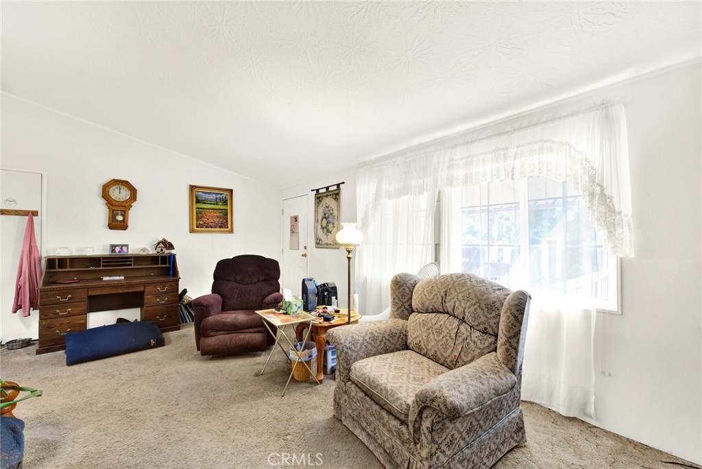 521 East Divisadero Corning, CA 96021 - Photo 31 of 54 a living room with furniture and a window