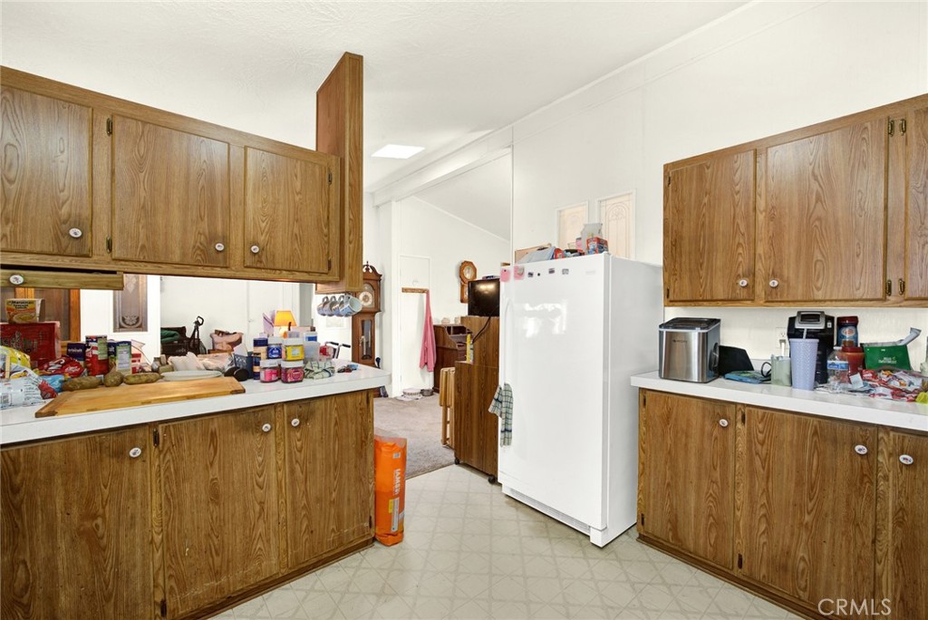 521 East Divisadero Corning, CA 96021 - Photo 37 of 54 a kitchen with a sink a stove and cabinets