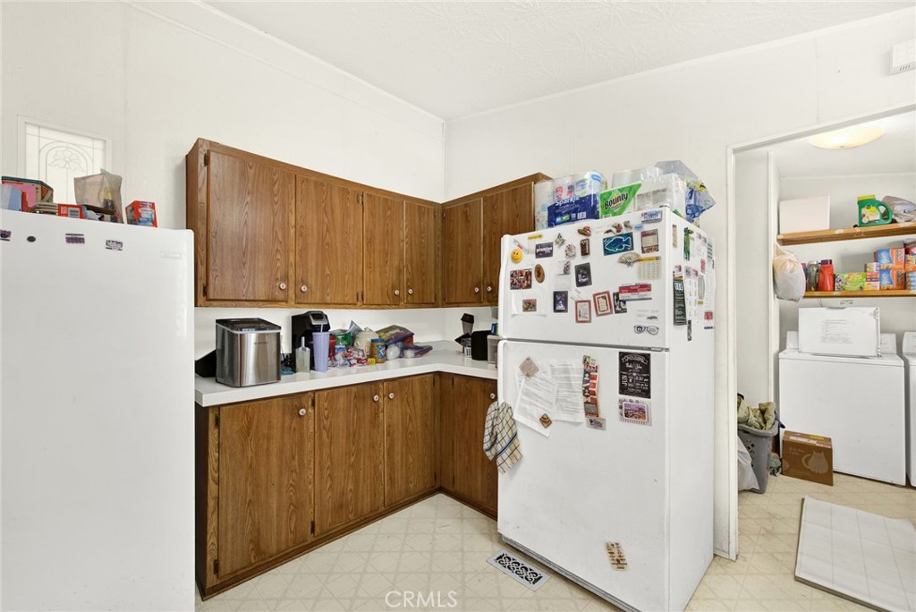 521 East Divisadero Corning, CA 96021 - Photo 38 of 54 a view of a kitchen with fridge and workspace