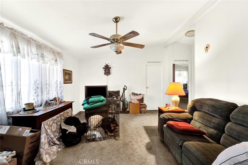 521 East Divisadero Corning, CA 96021 - Photo 40 of 54 a living room with furniture and a flat screen tv