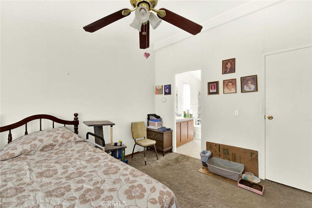 521 East Divisadero Corning, CA 96021 - Photo 43 of 54 a bedroom with a bed a desk and chair