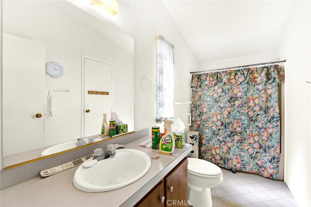 521 East Divisadero Corning, CA 96021 - Photo 45 of 54 a bathroom with a sink toilet and mirror
