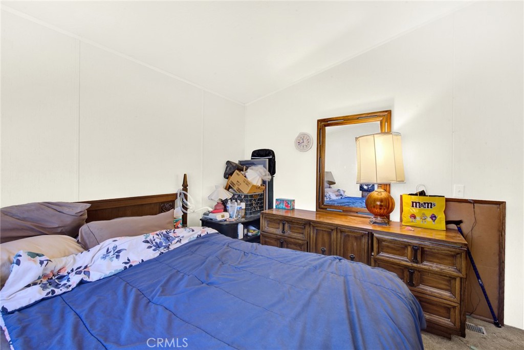 521 East Divisadero Corning, CA 96021 - Photo 50 of 54 a bedroom with a bed and a dresser in it