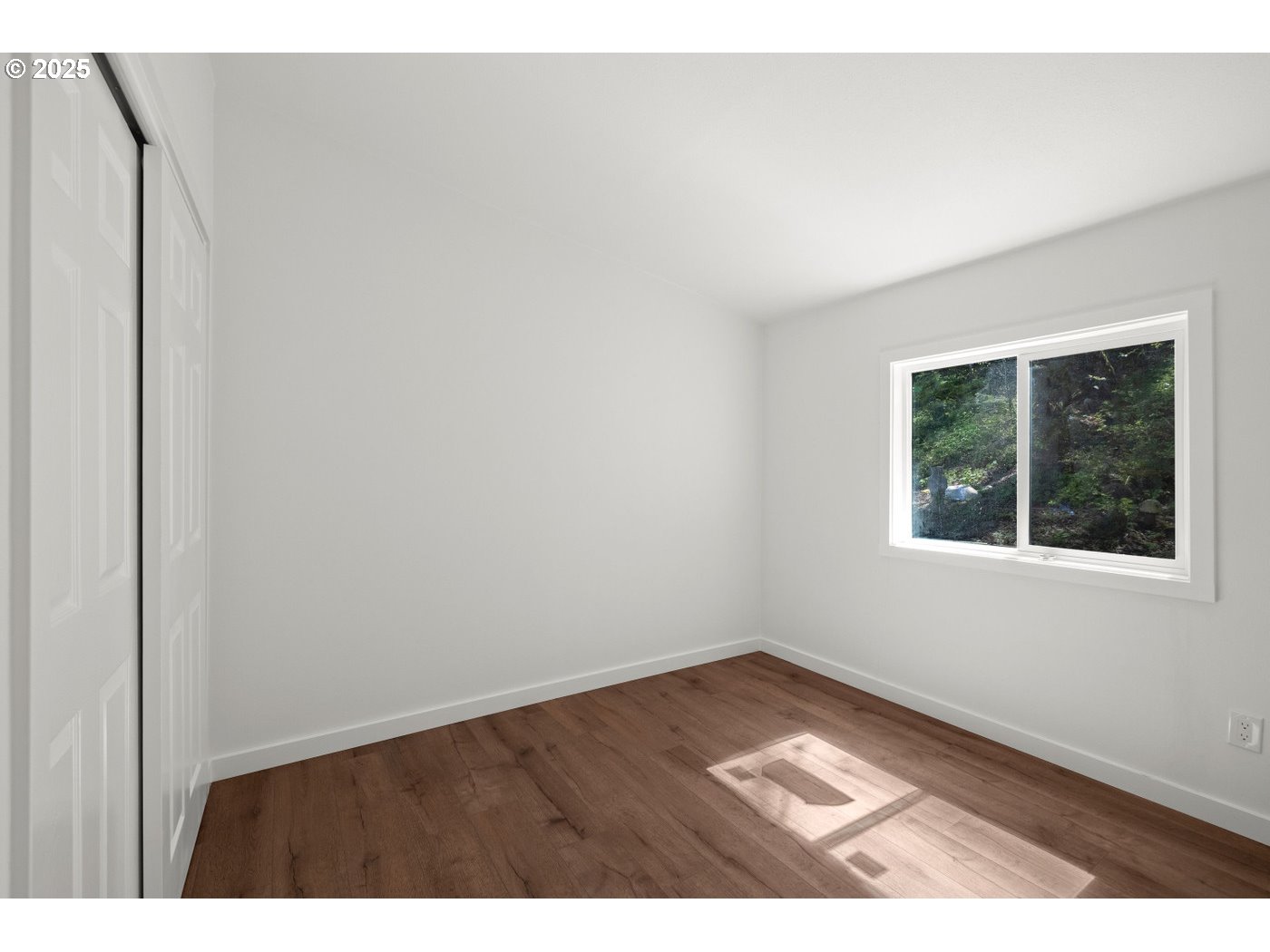 16000 Southeast Powell Boulevard, Unit 34 Portland, OR 97236 - Photo 18 of 28 a view of an empty room with a window