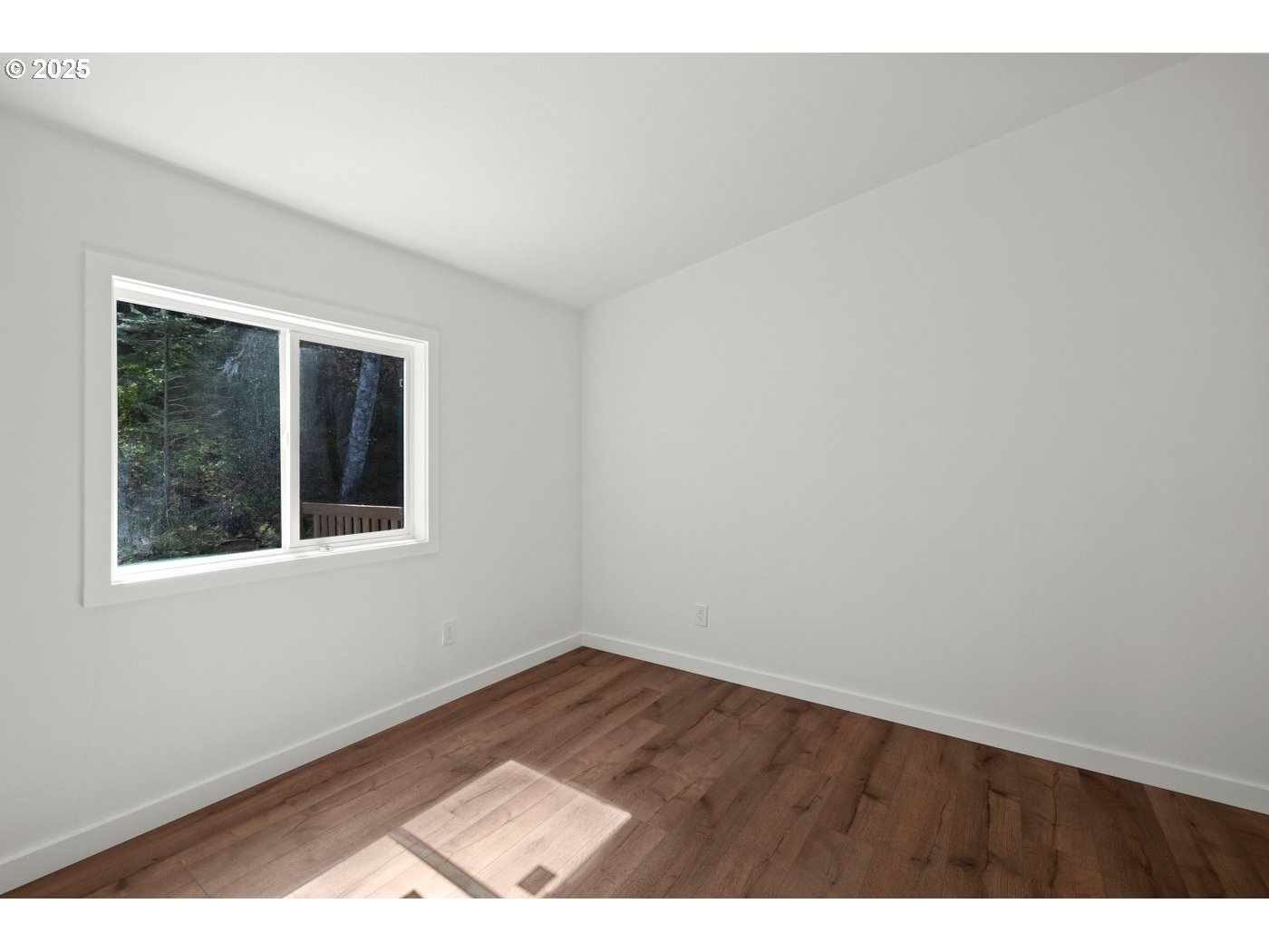 16000 Southeast Powell Boulevard, Unit 34 Portland, OR 97236 - Photo 19 of 28 a view of an empty room with a window