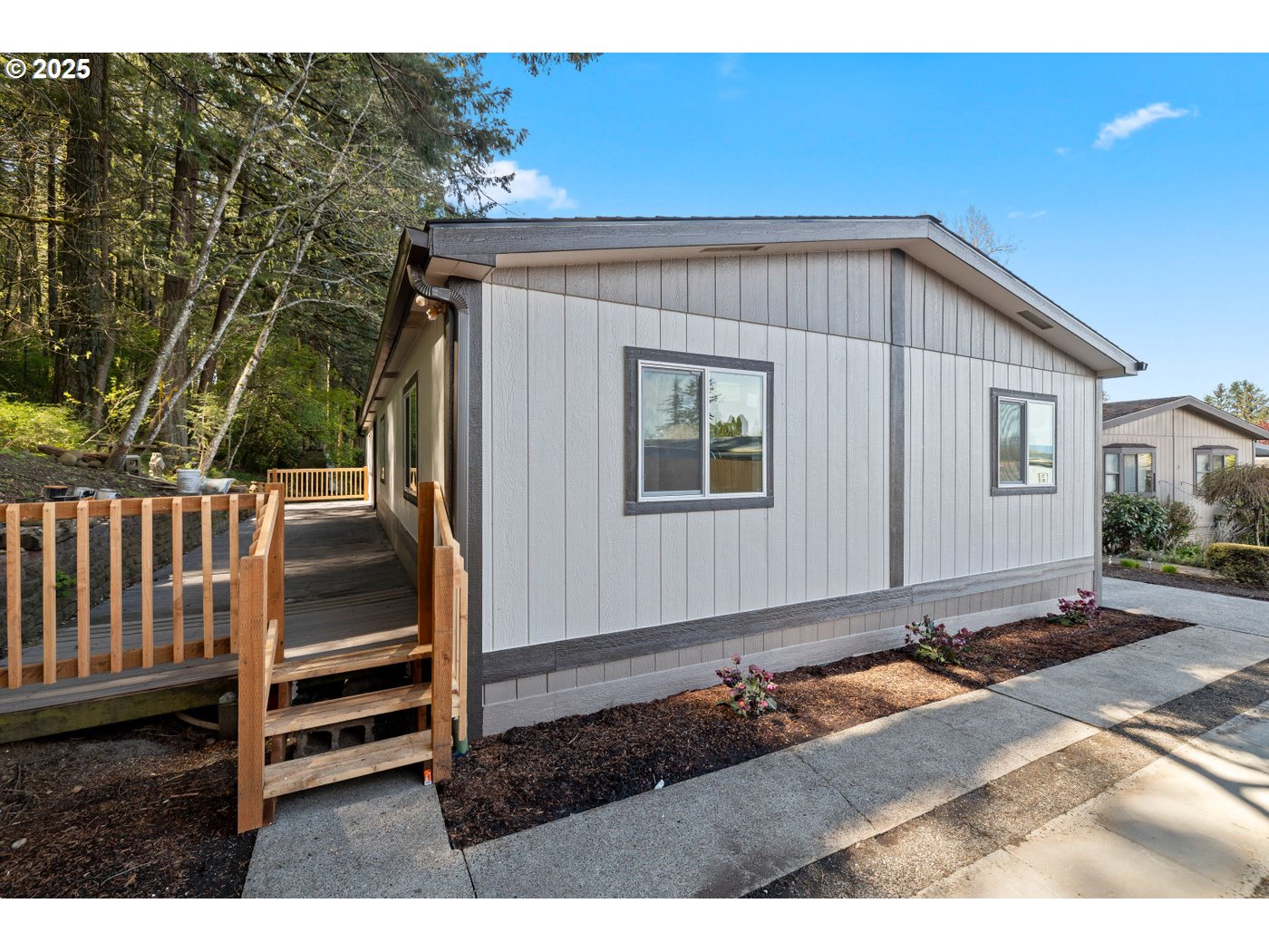 16000 Southeast Powell Boulevard, Unit 34 Portland, OR 97236 - Photo 21 of 28 a view of a house with backyard and deck