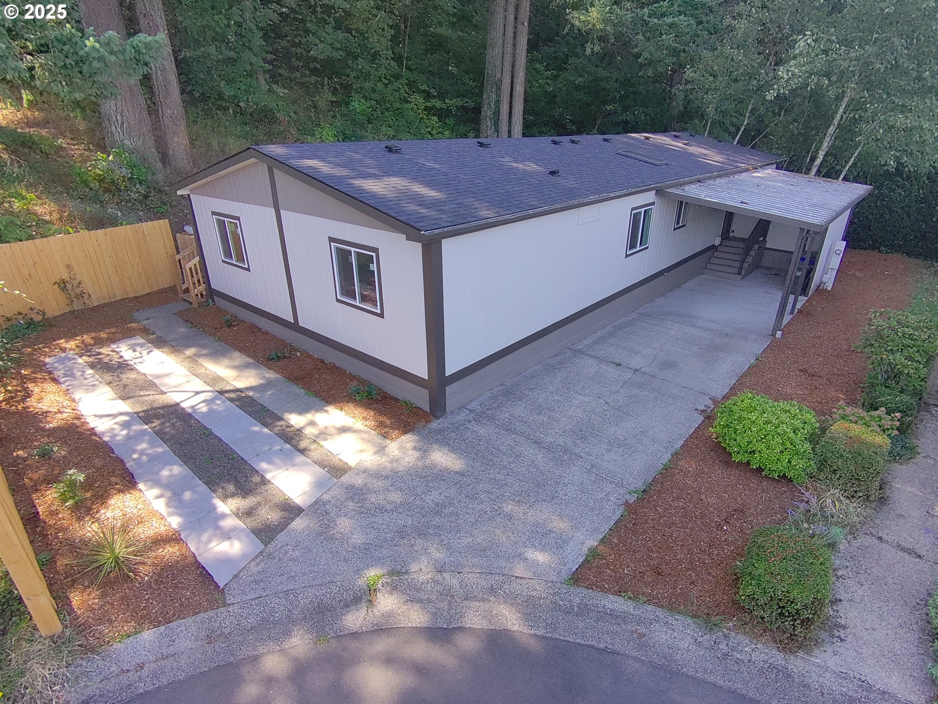 16000 Southeast Powell Boulevard, Unit 34 Portland, OR 97236 - Photo 24 of 28 a aerial view of a house with yard and mountain view in back