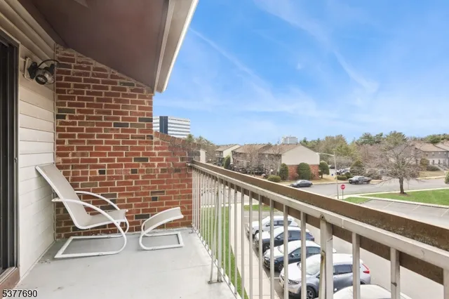 a view of balcony with wooden floor and city view
