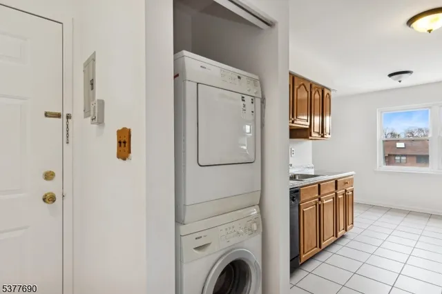 a view of a bathroom with washer and dryer