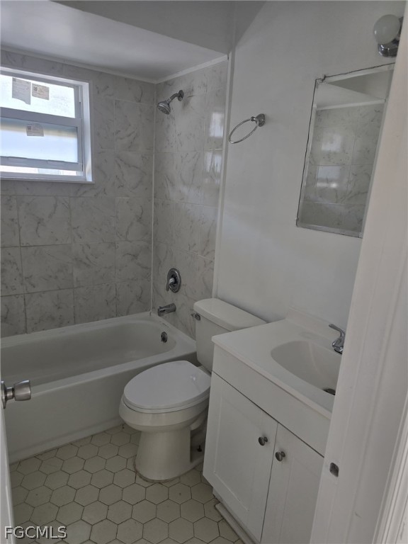 12941 First Street, Unit 943 Fort Myers, FL 33905 - Photo 2 of 7 a bathroom with a toilet a sink and bathtub