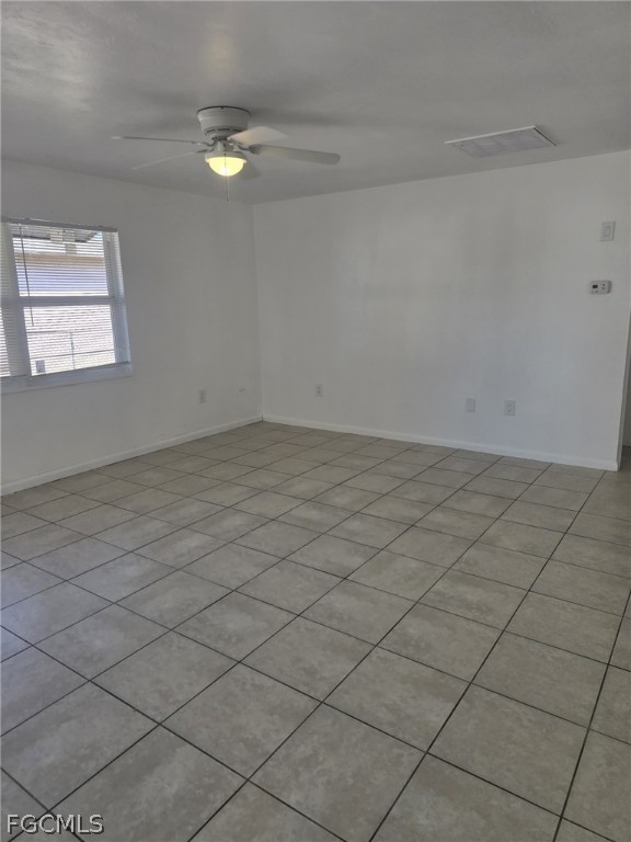 12941 First Street, Unit 943 Fort Myers, FL 33905 - Photo 5 of 7 an empty room with windows
