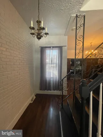a view of entryway with wooden floor