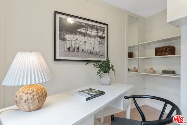 a workspace with furniture and window