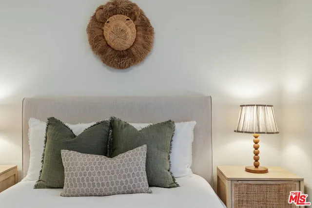 a bed room with a bed and a night stand