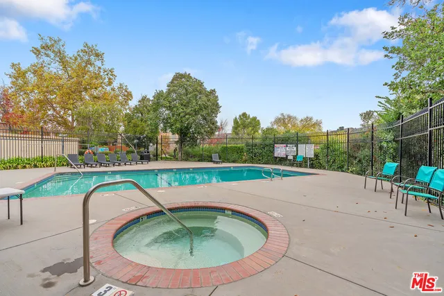a view of a swimming pool with a patio