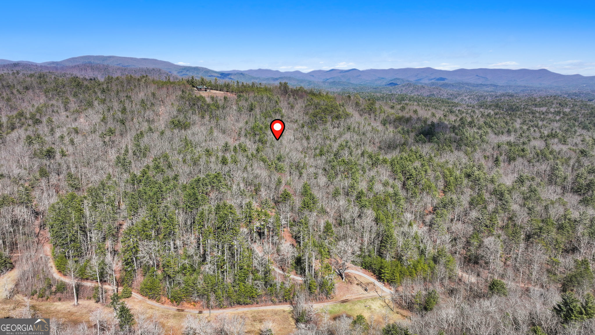 11.1-ac Stevens Ridge Road Ellijay, GA 30540 - Photo 3 of 16 a view of a lush green hillside and a houses