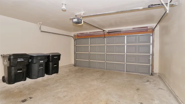 a view of a yard with wooden fence and a bench