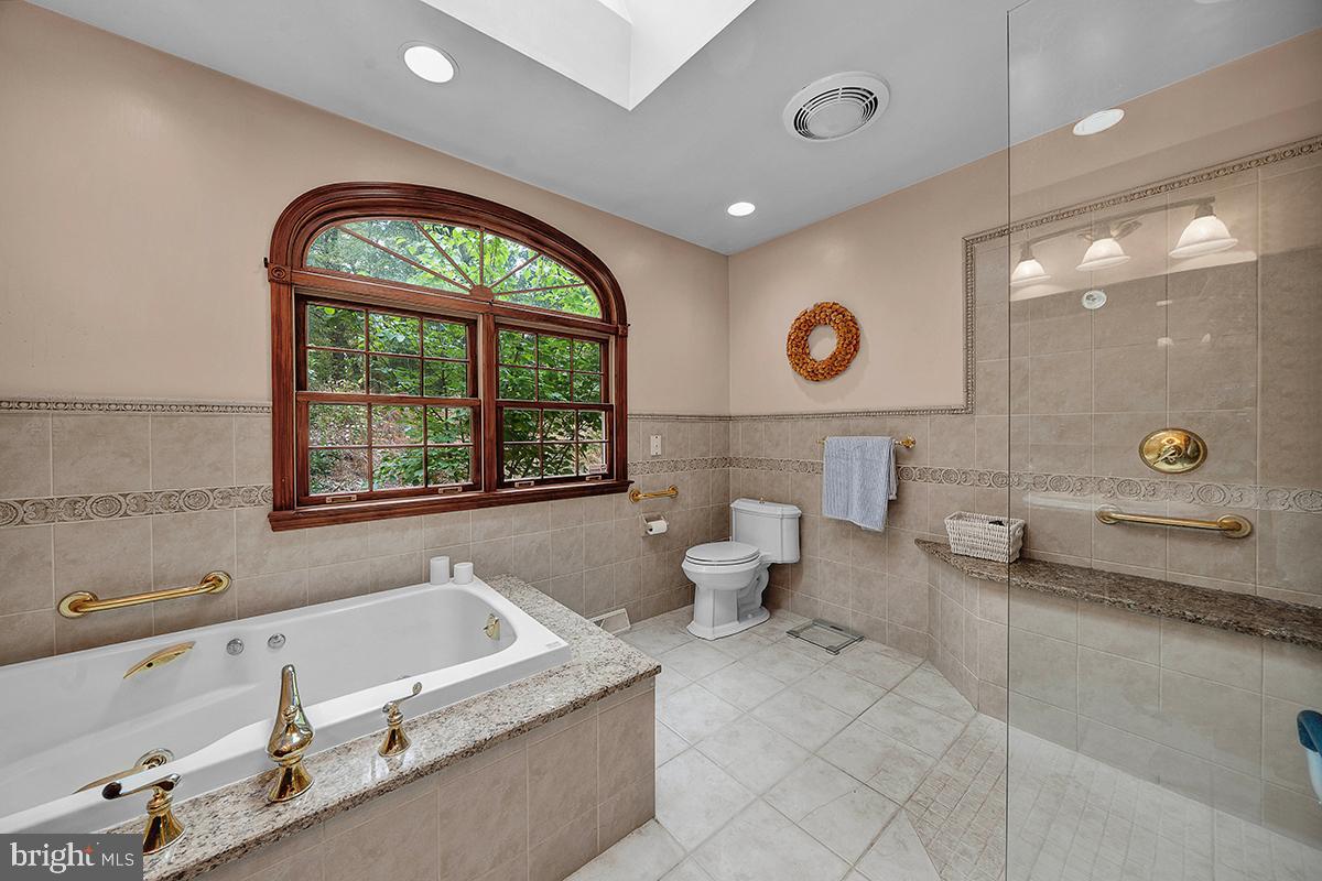 5 Quail Ridge Drive Reading, PA 19607 - Photo 39 of 70 1st floor primary bath with tub and shower stall