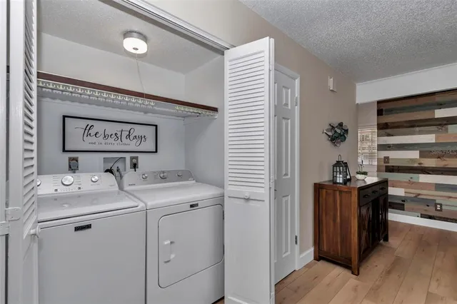 a view of storage and utility room with washer and dryer