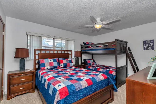 a bed room with a bed and a lamp