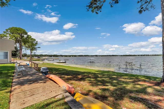 a view of a swimming pool and an outdoor seating