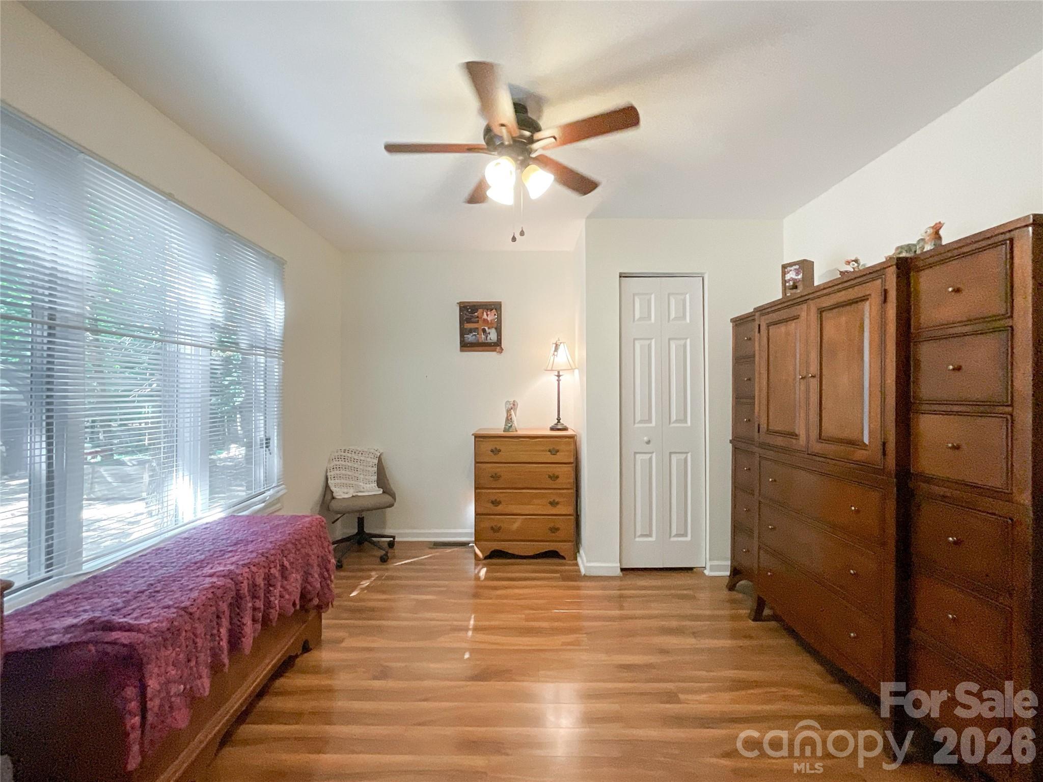 7200 Nesbit Road Waxhaw, NC 28173 - Photo 16 of 46 a bedroom with a bed and wooden floor