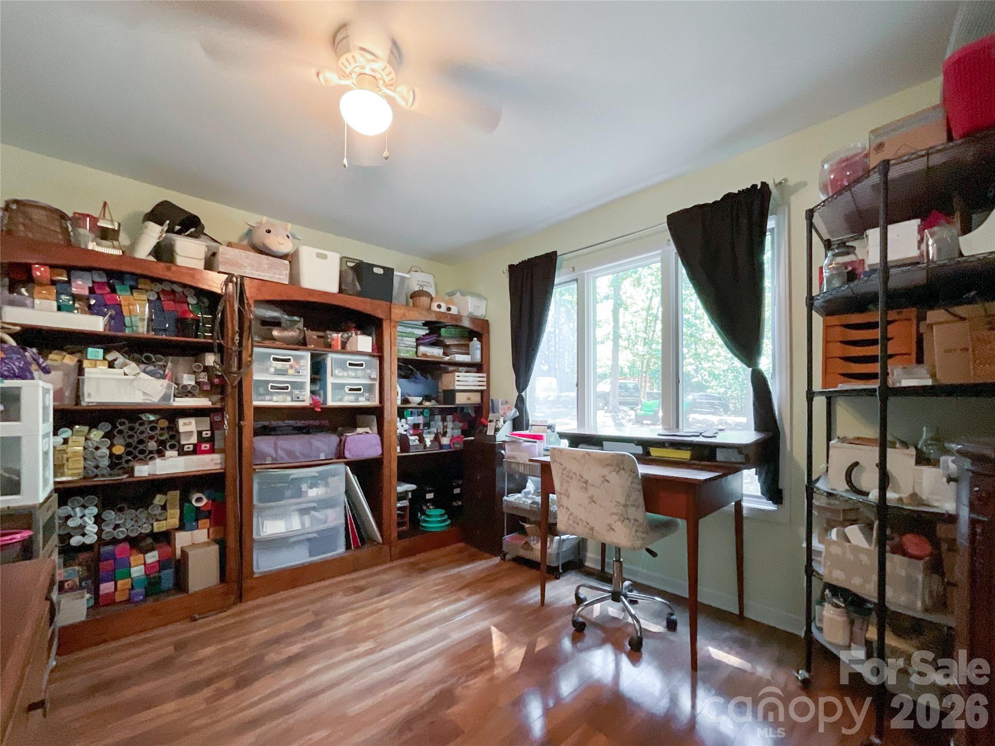 7200 Nesbit Road Waxhaw, NC 28173 - Photo 22 of 46 a view of a workspace with furniture and a window