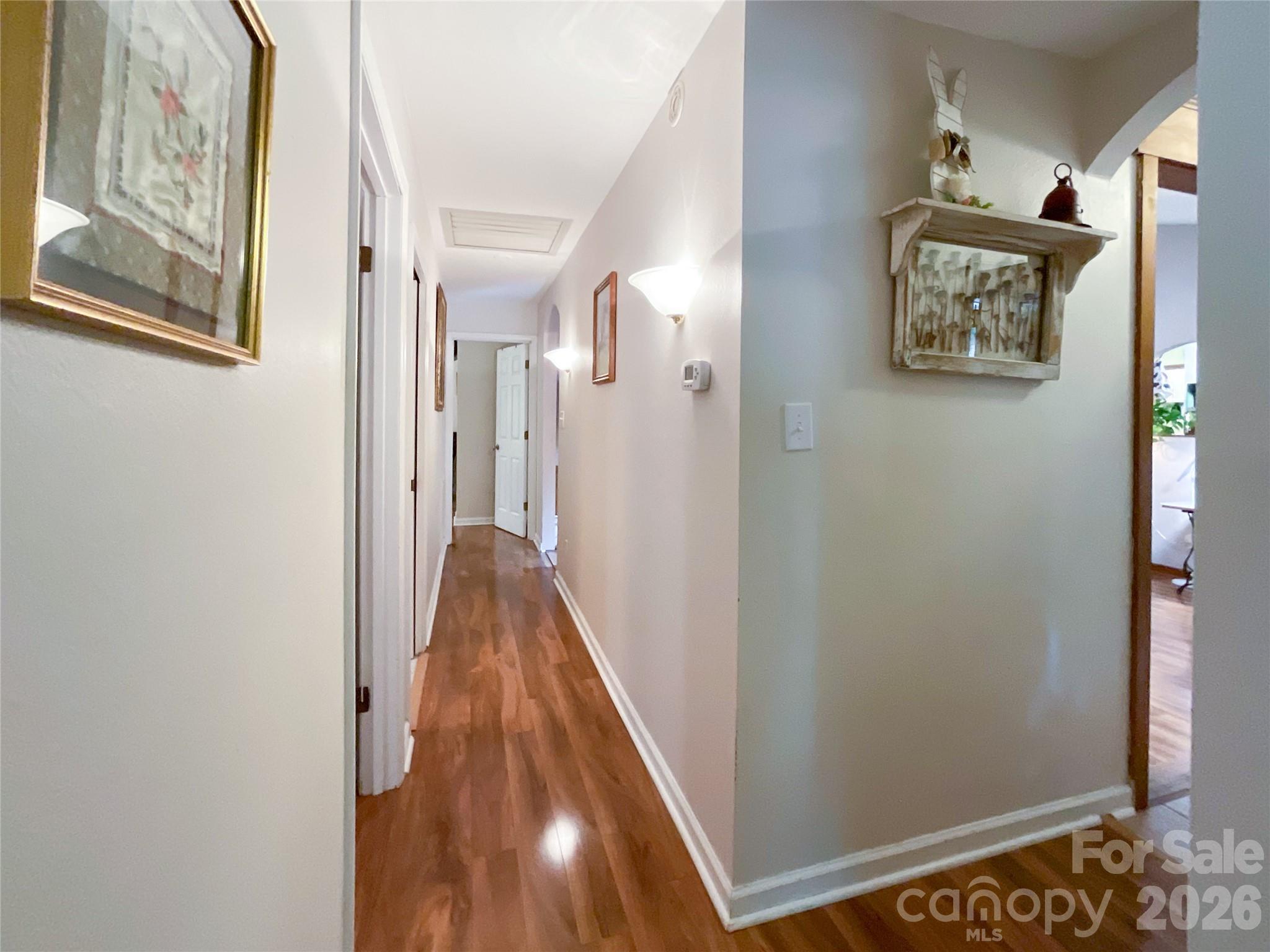 7200 Nesbit Road Waxhaw, NC 28173 - Photo 34 of 46 a view of a hallway with paintings on the wall