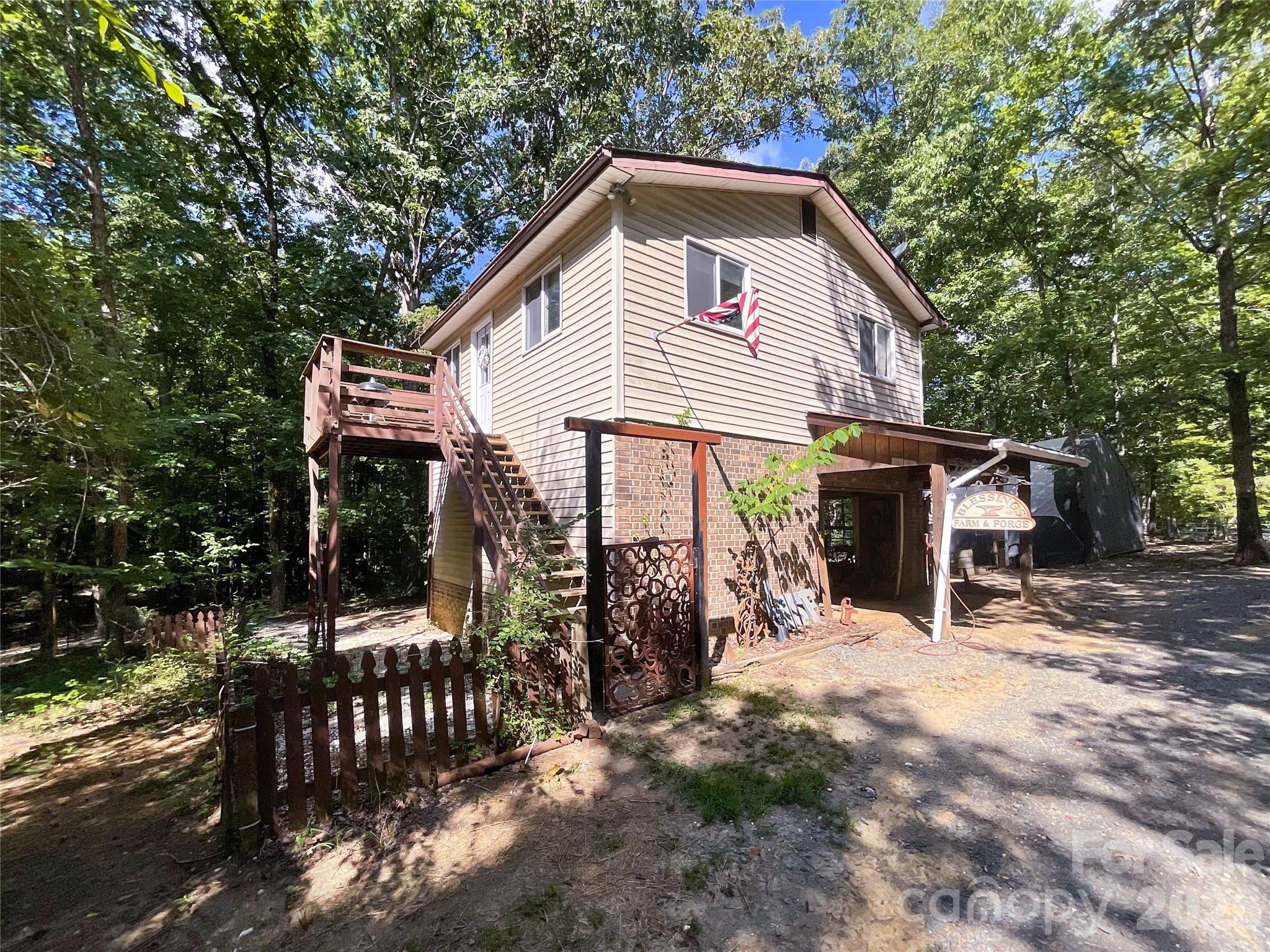 7200 Nesbit Road Waxhaw, NC 28173 - Photo 36 of 46 a front view of a house with garden