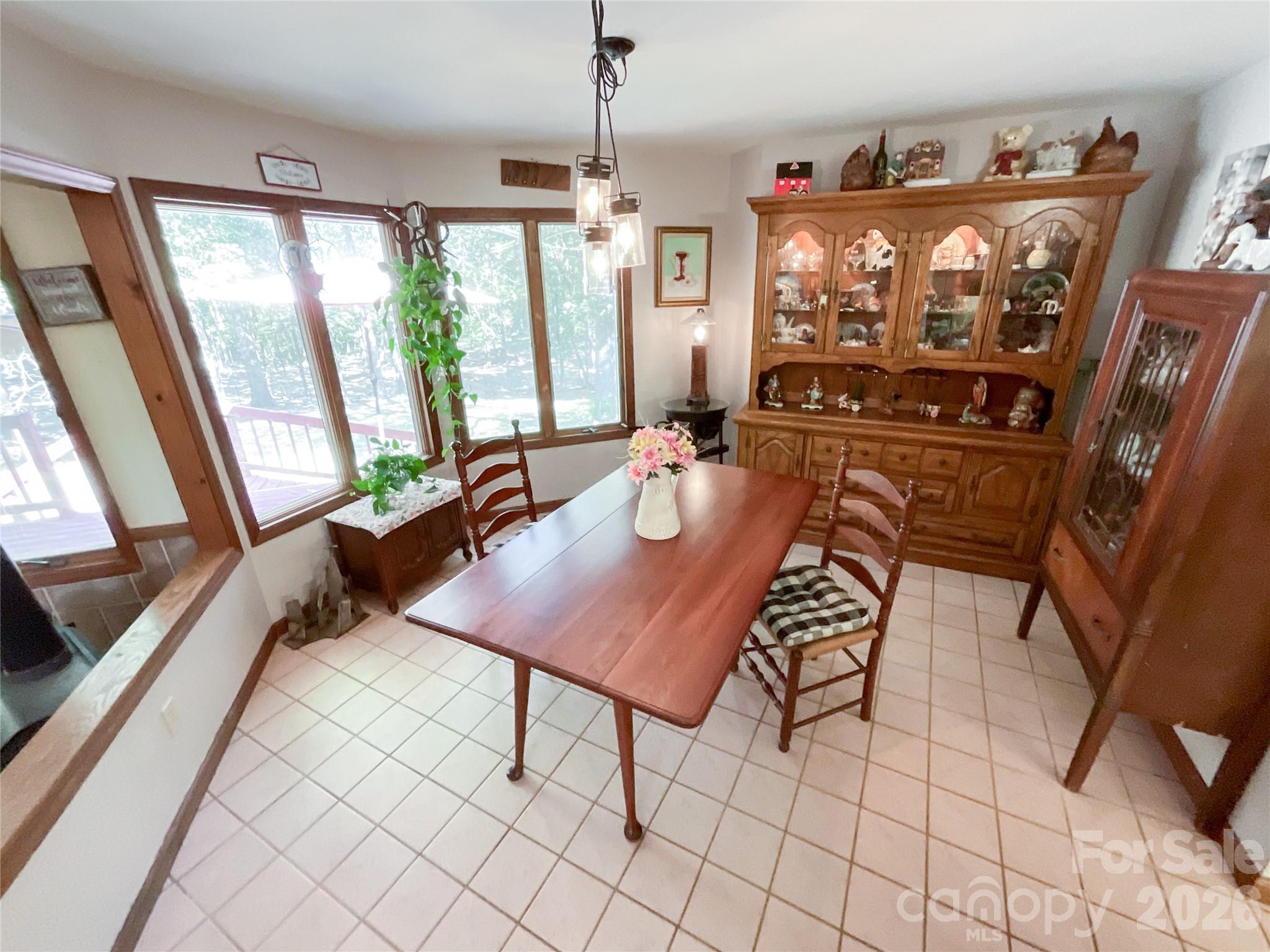 7200 Nesbit Road Waxhaw, NC 28173 - Photo 10 of 46 a view of a dining room with furniture window and outside view