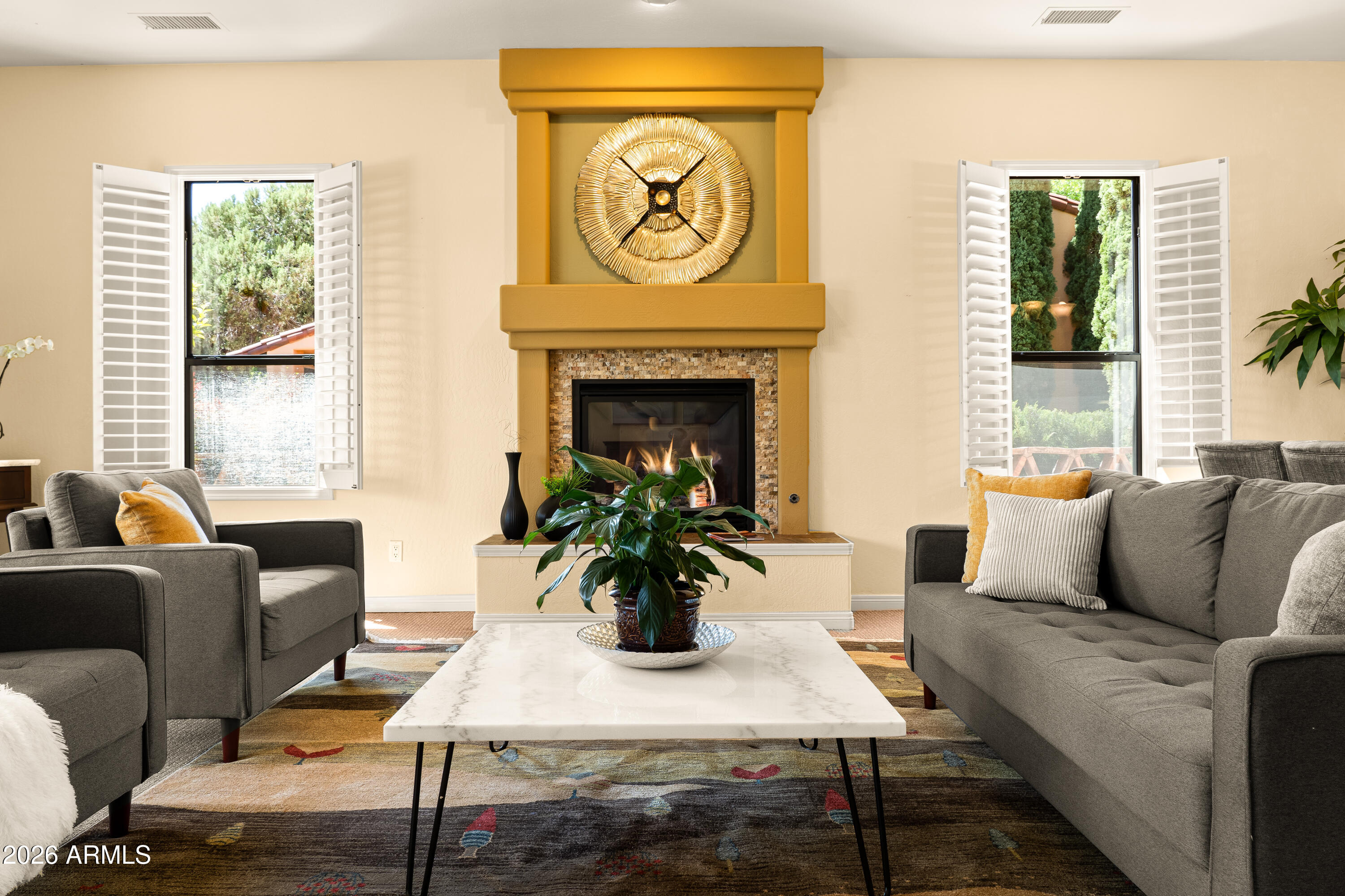39 Rim Trail Circle Sedona, AZ 86351 - Photo 13 of 41 a living room with furniture and a fireplace