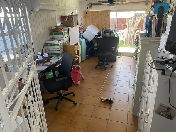 a work room with furniture and wooden floor