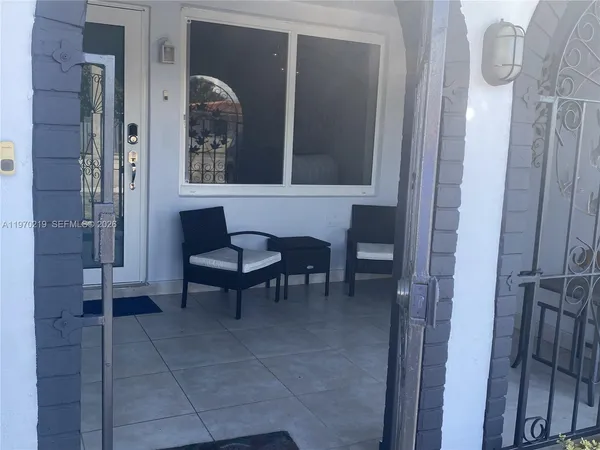 a living room with furniture and a window