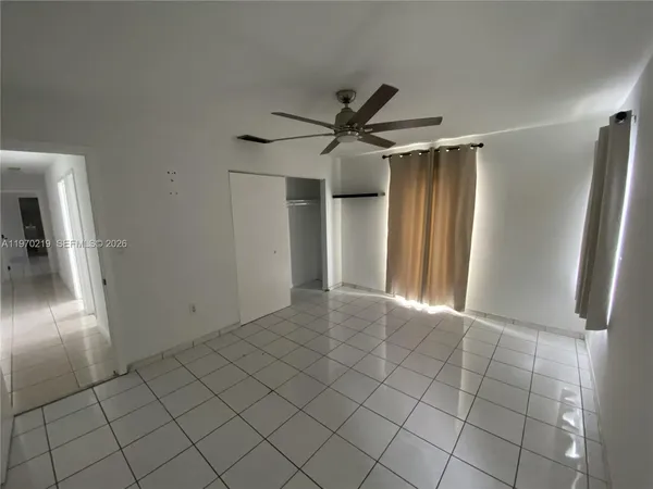 a view of bedroom with a bed and tv