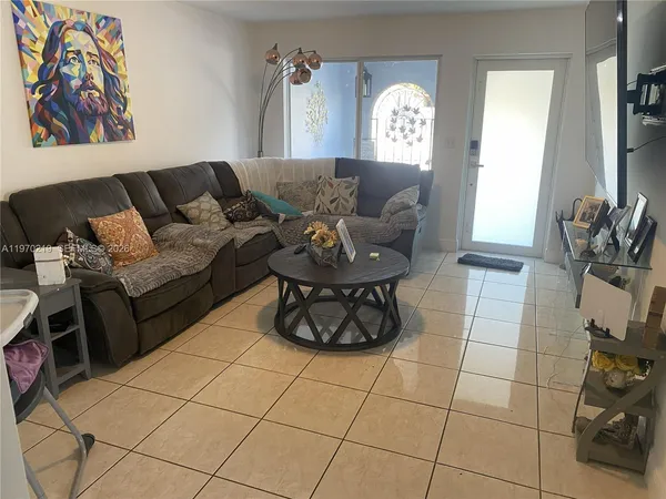 a kitchen with a sink cabinets and window
